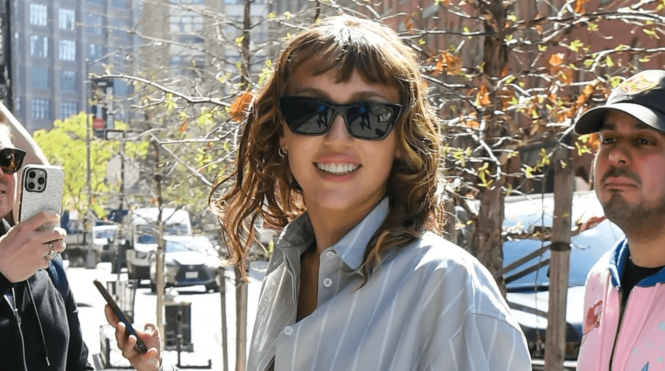 Miley Cyrus Masters Peekaboo Bra Trend With Oversized Shirt Look in NYC